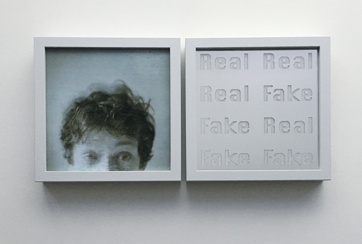 An image of the two exhibition pieces on the wall in frames